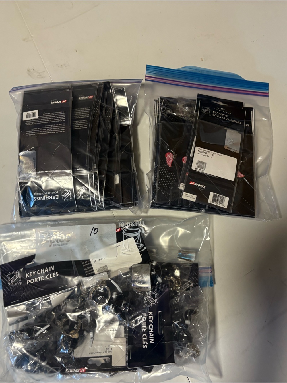 NHL Bulk Lot of Merchandise 100pc - Keychains, Earrings, and more - Brand New